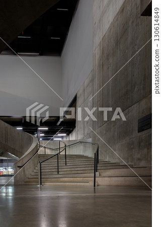 A curving flight concrete spiral staircase at Blavatnik Building of Tate Modern Switch House extension. 130614849