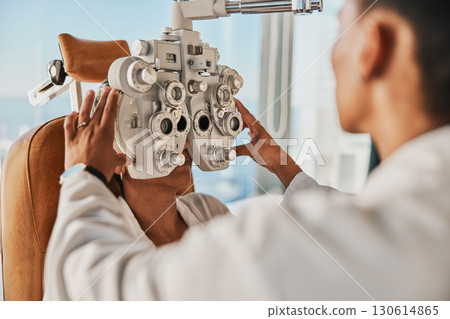 Senior optometry woman, eye exam patient and medical goal in hospital, consultation room and office with help. Elderly optician, eyesight test and phoropter for wellness, health and vision analysis 130614865