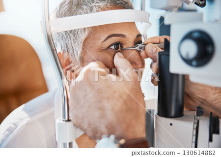 Help, hands or senior woman in eye exam with doctor eyesight at optometrist or ophthalmologist. Optician helping a mature customer testing or checking vision, iris or retina visual health in office Help, hands or senior woman in eye exam with doctor eyesight at optometrist or ophthalmologist. Optician helping a mature customer testing or checking vision, iris or retina visual health in office 130614882