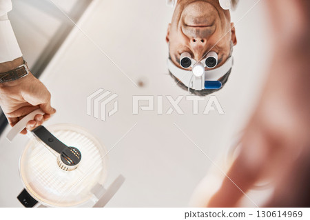 Eye exam, flashlight and face of optometrist looking down to patient for vision test, eyesight and optical exam Ophthalmology, clinic and man in consultation for retina, eyes and medical surgery Eye exam, flashlight and face of optometrist looking down to patient for vision test, eyesight and optical exam Ophthalmology, clinic and man in consultation for retina, eyes and medical surgery 130614969