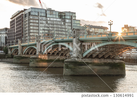 View of Southwark Bridge cross The River Thames with Modern buildings in the background. 130614991