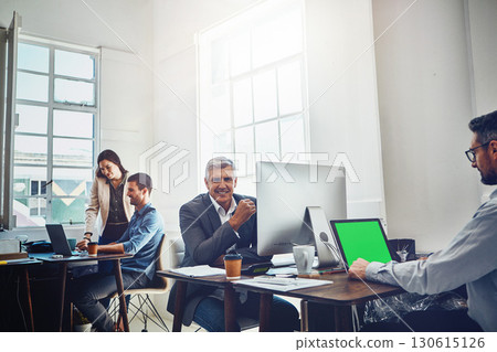 Portrait, teamwork and business man by computer in office workplace. Laptop, mockup green screen and elderly male employee working on marketing, advertising or sales project with people or coworkers. 130615126