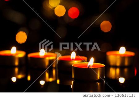 Each wax tealight spreads warmth through the night air Each wax tealight spreads warmth through the night air 130615135