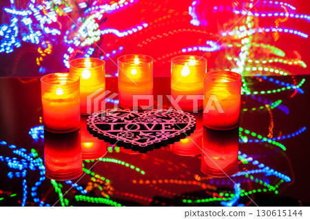 The burning candles bring warmth and tenderness to the frame. The burning candles bring warmth and tenderness to the frame. 130615144