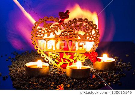 Candles flicker on a background of colorful shimmer, surrounding everything with a romantic glow. 130615146
