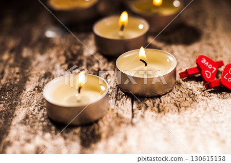 Small candles evenly light up the space around them 130615158