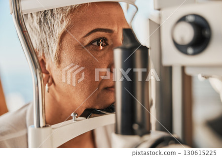 Medical, ophthalmology and eye test by patient senior woman with medical insurance using slit lamp. Mature, optometry and female doing vision or eyesight test in clinic using a machine Medical, ophthalmology and eye test by patient senior woman with medical insurance using slit lamp. Mature, optometry and female doing vision or eyesight test in clinic using a machine 130615225