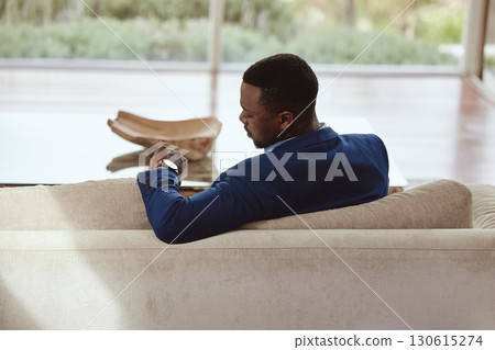 Time, businessman and waiting on a sofa for appointment, meeting or property showing. Watch, realtor and black man sitting in a living room, timing, schedule and new house property investment Time, businessman and waiting on a sofa for appointment, meeting or property showing. Watch, realtor and black man sitting in a living room, timing, schedule and new house property investment 130615274