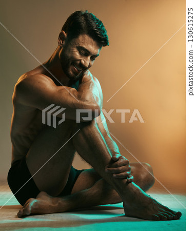 Fitness, wellness and man in neon studio with smile for exercise, bodybuilder training and workout. Beauty, skincare and male model in underwear on floor with muscles, sports goals and motivation Fitness, wellness and man in neon studio with smile for exercise, bodybuilder training and workout. Beauty, skincare and male model in underwear on floor with muscles, sports goals and motivation 130615275