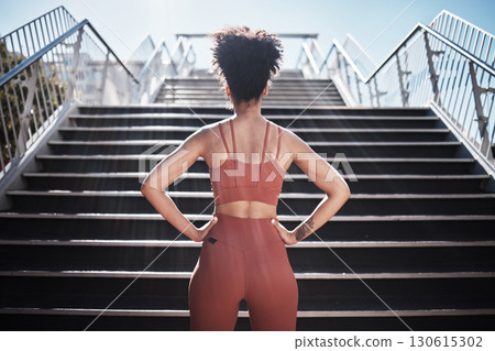 Fitness, woman and stairs for sport in city for running, exercise or healthy cardio preparation. Back of African American female ready for training, workout or sports run for wellness by staircase Fitness, woman and stairs for sport in city for running, exercise or healthy cardio preparation. Back of African American female ready for training, workout or sports run for wellness by staircase 130615302