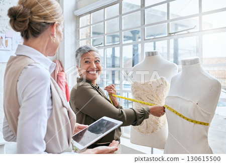 Fashion, designer and tape with business people and mannequin for planning, ecommerce and manufacturing. Management, tablet and creative with women in factory studio for retail and online shopping Fashion, designer and tape with business people and mannequin for planning, ecommerce and manufacturing. Management, tablet and creative with women in factory studio for retail and online shopping 130615500