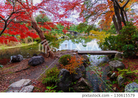Kyoto Shosei-en Garden: Sensetsu Bridge over Ingetsu Pond and Kyoto Tower reflected in the water 130615579