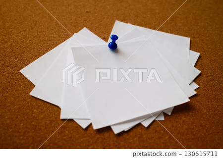 white blank notes pinned to a cork message board 130615711