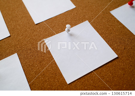 white blank notes pinned to a cork message board 130615714