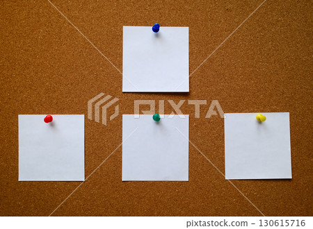 Four white blank notes pinned to a cork message board Four white blank notes pinned to a cork message board 130615716