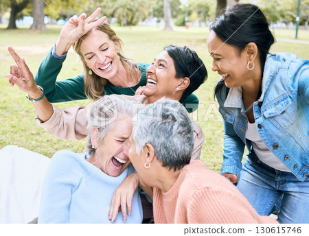 Retirement, women and laughing in funny games, comic bonding and silly global activity with peace sign hands. Smile, happy and elderly senior friends in nature park, grass garden or community support 130615746