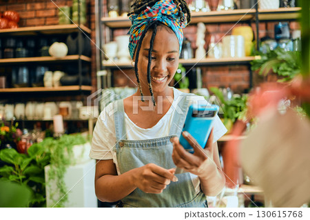 Credit card, pos payment or florist woman, startup small business owner or manager with retail sales product. Commerce shopping service, flower store or African worker with financial fintech purchase Credit card, pos payment or florist woman, startup small business owner or manager with retail sales product. Commerce shopping service, flower store or African worker with financial fintech purchase 130615768