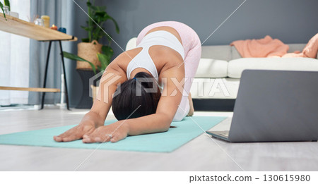 Stretching, yoga or woman in online class for fitness exercise or live streaming a workout at home. Extended dog pose, laptop or healthy person with a flexible spine training body in zen meditation Stretching, yoga or woman in online class for fitness exercise or live streaming a workout at home. Extended dog pose, laptop or healthy person with a flexible spine training body in zen meditation 130615980