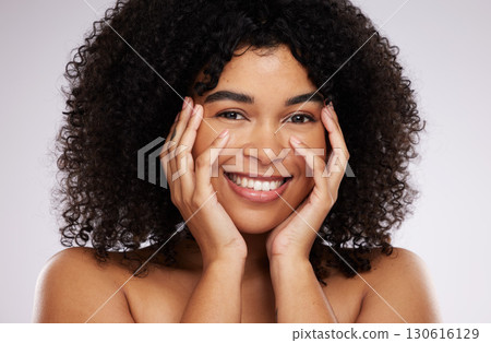 Portrait, beauty and afro with a black woman in studio on a gray background for natural hair treatment. Face, skincare and haircare with an attractive young female model posing to promote cosmetics 130616129