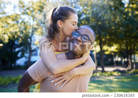 Interracial, piggy back and couple in park, happiness and bonding for romance, loving and smile. Romantic, black man and woman on back, nature and love for relationship, dating and playful together 130616165