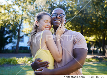 Love, interracial and couple hug in park, bonding and happiness for romance, wellness and quality time together. Romantic, black man and woman embrace, dating and loving for relationship and smile 130616172