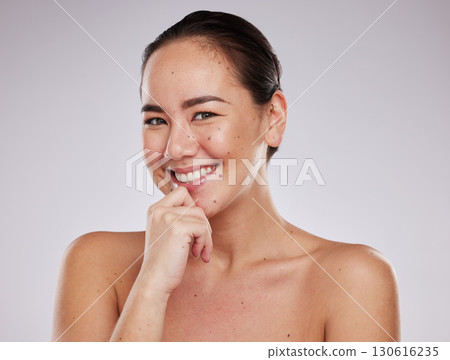 Portrait, face smile and skincare of Asian woman in studio isolated on a gray background. Makeup, beauty cosmetics and happy female model with glowing, healthy or flawless skin after facial treatment 130616235