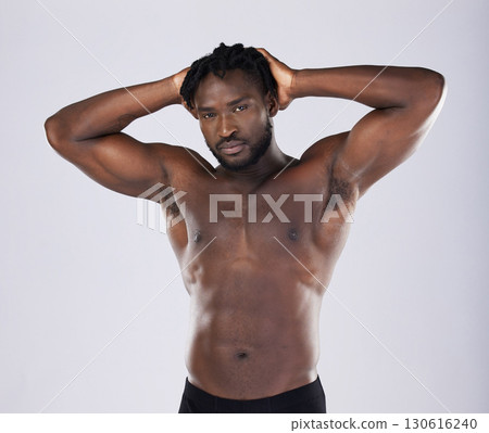 Sexy body, fitness and black man portrait for sports person in studio for strong muscle and power. Health and wellness of a male bodybuilder model with growth after exercise, workout and training Sexy body, fitness and black man portrait for sports person in studio for strong muscle and power. Health and wellness of a male bodybuilder model with growth after exercise, workout and training 130616240
