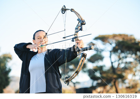 Happy woman, bow or arrows aim in sports field, shooting range or gaming nature in hunting, hobby or exercise. Archery, person or athlete smile with weapon in target training, competition or practice 130616319