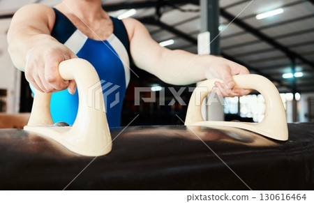 Hands, horse and gymnastics with a sports man training for competition in a gym or fitness arena. Health, workout and exercise with a male gymnast or athlete in a studio for tournament preparation Hands, horse and gymnastics with a sports man training for competition in a gym or fitness arena. Health, workout and exercise with a male gymnast or athlete in a studio for tournament preparation 130616464