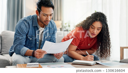 Couple, writing and reading document at house for financial planning, review budget and bills invoice. People, paperwork and application for home insurance, mortgage expenses and reminder for payment 130616604