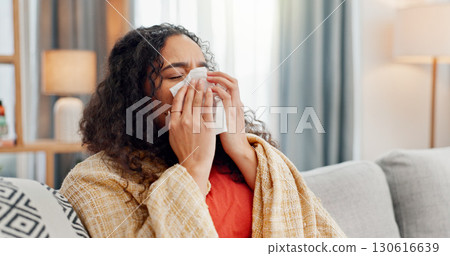 Sick, woman and blow nose in home for winter allergies, cold disease and virus infection. Flu, tissue paper and person in living room on sofa with blanket, bacteria and health problem with hay fever Sick, woman and blow nose in home for winter allergies, cold disease and virus infection. Flu, tissue paper and person in living room on sofa with blanket, bacteria and health problem with hay fever 130616639