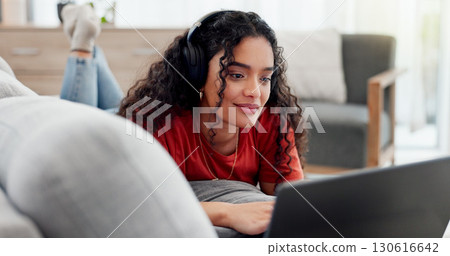 Happy, headphones and laptop with woman on sofa for streaming service, film website or comfortable. Movie subscription, watching series and entertainment with person in living room of home for search Happy, headphones and laptop with woman on sofa for streaming service, film website or comfortable. Movie subscription, watching series and entertainment with person in living room of home for search 130616642