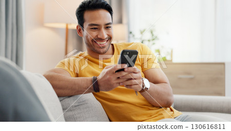 Phone, relax and happy man in home for internet, social media post and reading news. Cellphone, living room and person with app for online text, communication and check message with notification 130616811