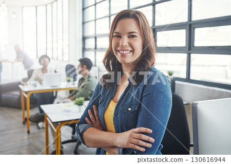 Creative business woman, leader and arms crossed with smile for management, career or vision at the office. Portrait of a young designer standing and smiling in happiness for job, goals or startup Creative business woman, leader and arms crossed with smile for management, career or vision at the office. Portrait of a young designer standing and smiling in happiness for job, goals or startup 130616944