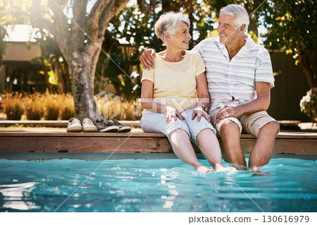 Senior couple, hug and swimming pool for holiday in relax for love or quality bonding time together on summer vacation. Happy elderly man holding woman relaxing with feet in water by the poolside Senior couple, hug and swimming pool for holiday in relax for love or quality bonding time together on summer vacation. Happy elderly man holding woman relaxing with feet in water by the poolside 130616979