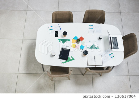 Empty office, laptop or documents in digital agency space, advertising startup or creative small business. Furniture, top view or paper for research in office building with table, desk and chairs 130617004