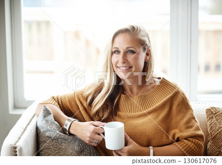 Woman, thinking and relax happy with tea on sofa in living room for morning mindfulness peace, calm vision and planning lifestyle ideas in home. Female, smile and mindset thought with coffee on couch Woman, thinking and relax happy with tea on sofa in living room for morning mindfulness peace, calm vision and planning lifestyle ideas in home. Female, smile and mindset thought with coffee on couch 130617076