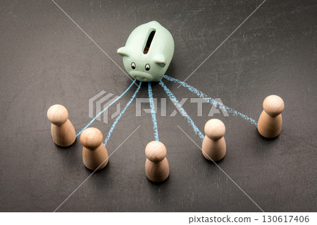 Piggy bank distributing money to multiple people as financial concept Piggy bank distributing money to multiple people as financial concept 130617406