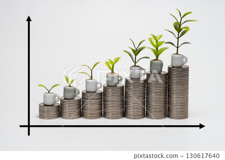 Image of a graph showing money increasing with stacked coins 130617640