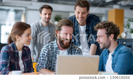 Realistic photo of team discussing software project around laptop 130618088