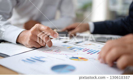 Realistic image of financial advisor presenting investment strategy to client 130618387