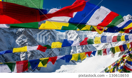 Colorful Tibetan Prayer Flags Against Snow-Capped Himalayan Mountains 130618650