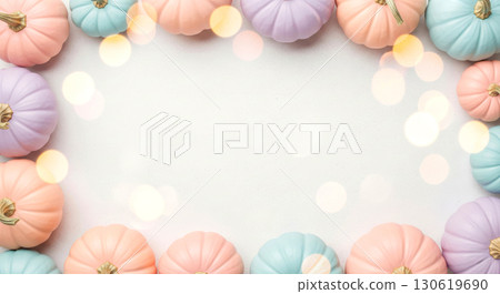 Pastel-colored pumpkin border with soft bokeh lights. Autumn or holiday celebration. Pastel-colored pumpkin border with soft bokeh lights. Autumn or holiday celebration. 130619690
