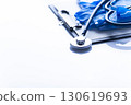 Healthcare medical background with copy-space of stethoscope, clipboard, gloves and folded overalls on white table 130619693