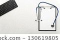 Medical background of stethoscope clipboard and computer keyboard flat lay on table with copy-space 130619805