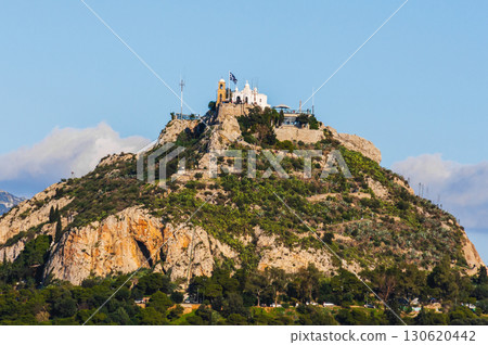 Lycabettus Hill with Saint George church and Greek flag in Athens, Greece. 130620442