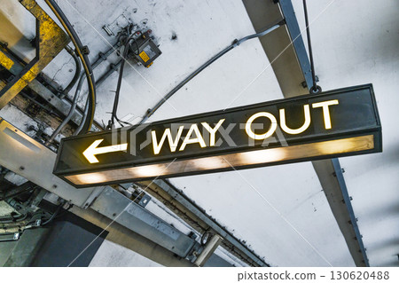 Way Out Exit Sign with Left Arrow in Underground Metro Station Way Out Exit Sign with Left Arrow in Underground Metro Station 130620488