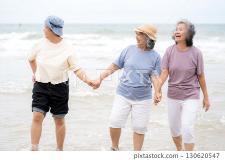 Group senior asian woman laughing and playing together at beach. 130620547