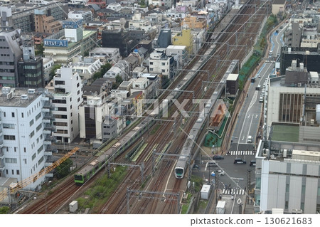Seibu Shinjuku Line 30000 series train running parallel to the Yamanote Line 130621683