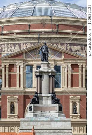a crowning portrait statue of Prince Albert monument stands in front of the Royal Albert Hall. 130622122